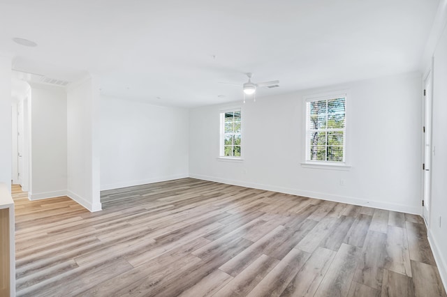 empty room featuring ceiling fan and light wood-type flooring