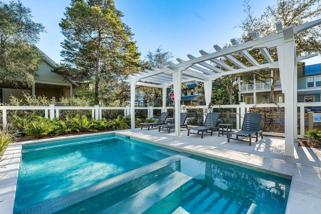 view of swimming pool featuring a patio area and a pergola