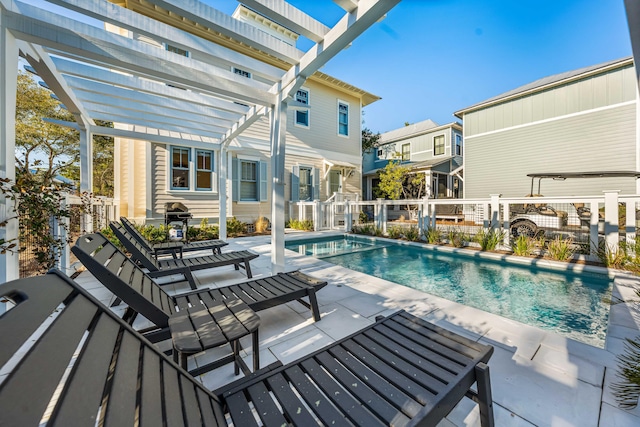 view of swimming pool with a patio and a pergola