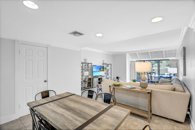 dining room featuring crown molding