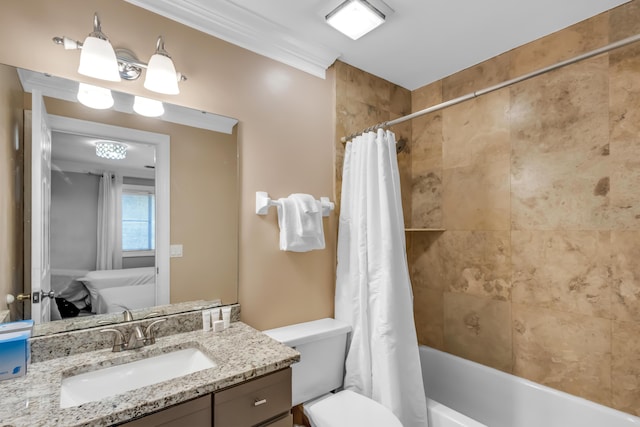 full bathroom featuring vanity, toilet, crown molding, and shower / tub combo