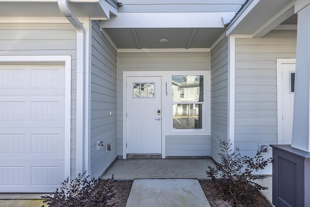 entrance to property featuring a garage