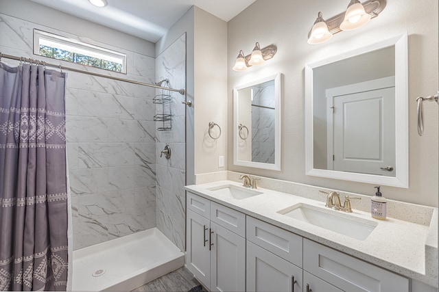 bathroom featuring double vanity and a shower with shower curtain