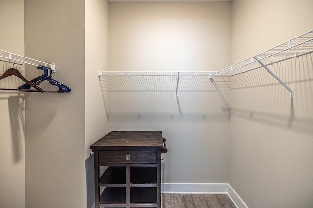 spacious closet featuring hardwood / wood-style floors