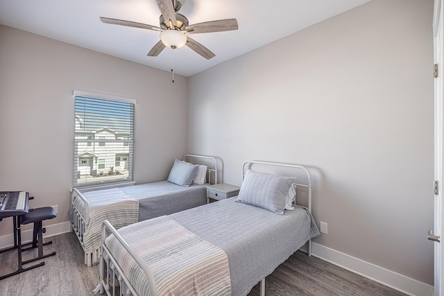 bedroom with ceiling fan and hardwood / wood-style floors