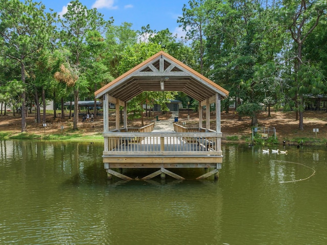 dock area with a gazebo and a water view