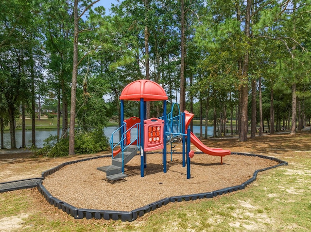 view of playground with a water view