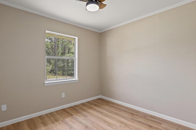 empty room with light hardwood / wood-style flooring, ornamental molding, and ceiling fan