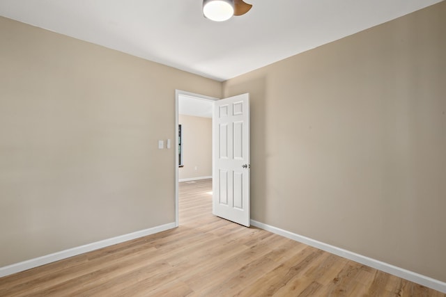 spare room with light hardwood / wood-style flooring