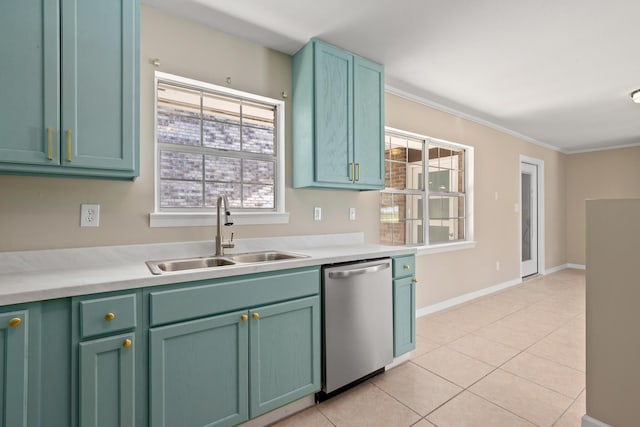 kitchen featuring dishwasher, sink, ornamental molding, light tile patterned floors, and green cabinetry