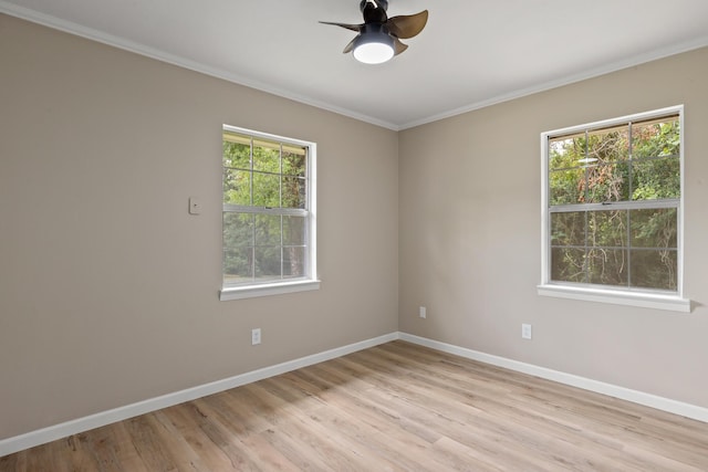 empty room with crown molding, ceiling fan, and light hardwood / wood-style flooring