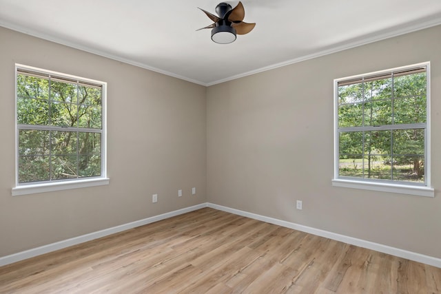 empty room with crown molding, ceiling fan, and light hardwood / wood-style flooring