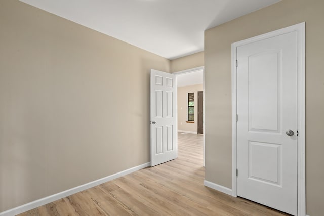 unfurnished room featuring light wood-type flooring