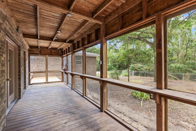 unfurnished sunroom featuring wooden ceiling