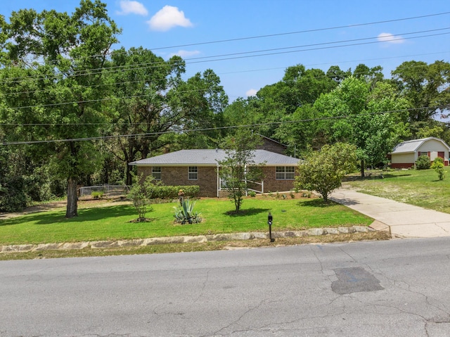 ranch-style house featuring a front lawn