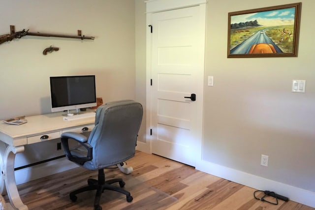 office with light wood finished floors and baseboards