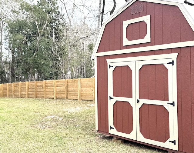 view of shed with fence