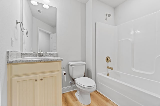 5816 Crestlake Dr, Crestview, FL 32536 - bathroom featuring wood finished floors, toilet, washtub / shower combination, and vanity