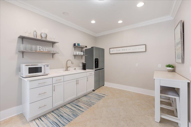 kitchen with light colored carpet, sink, stainless steel fridge, and crown molding