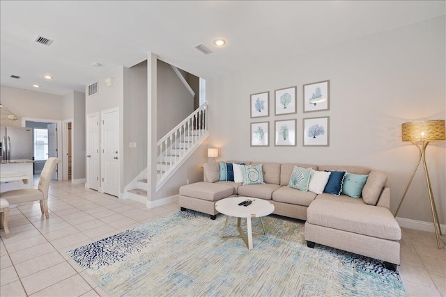 living room featuring light tile floors