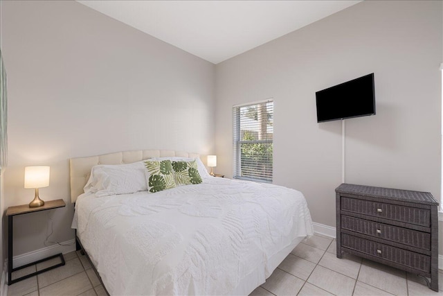 bedroom featuring light tile floors