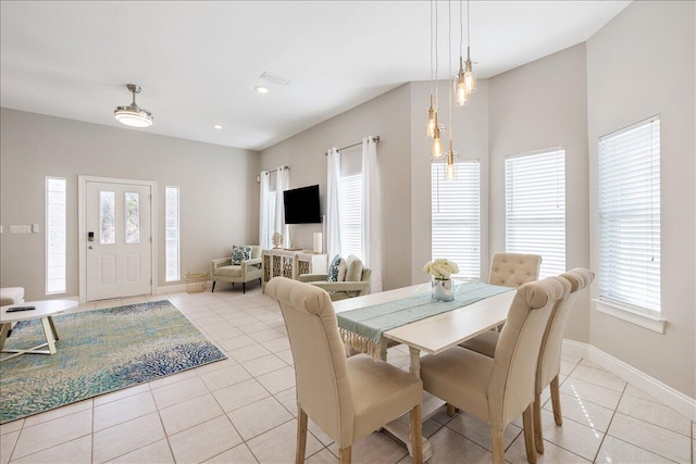 dining space with light tile floors