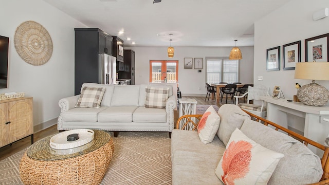 living room with light hardwood / wood-style flooring