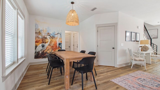 dining area with light hardwood / wood-style floors