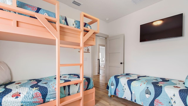 bedroom with hardwood / wood-style floors