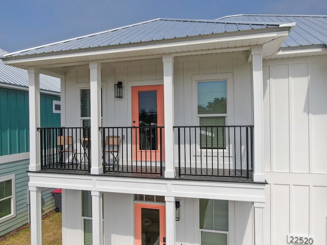 rear view of property with a balcony