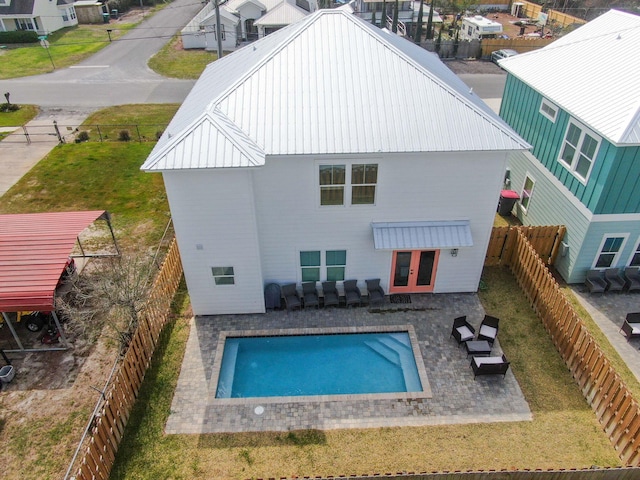 rear view of property featuring a yard and a patio area