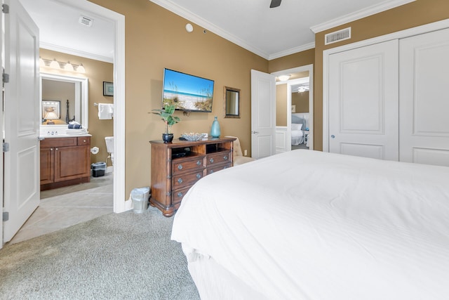 bedroom featuring light colored carpet, visible vents, and crown molding