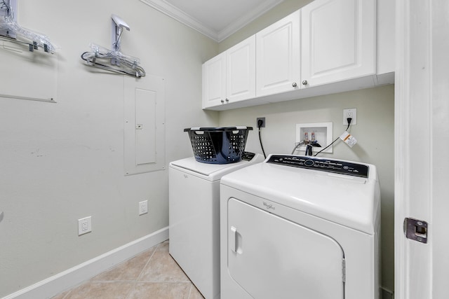 laundry area featuring light tile patterned floors, separate washer and dryer, baseboards, ornamental molding, and cabinet space