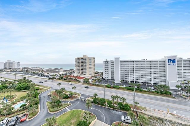 birds eye view of property featuring a view of city and a water view