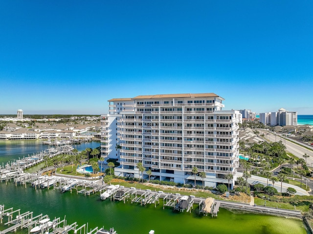 view of property featuring a water view and a view of city