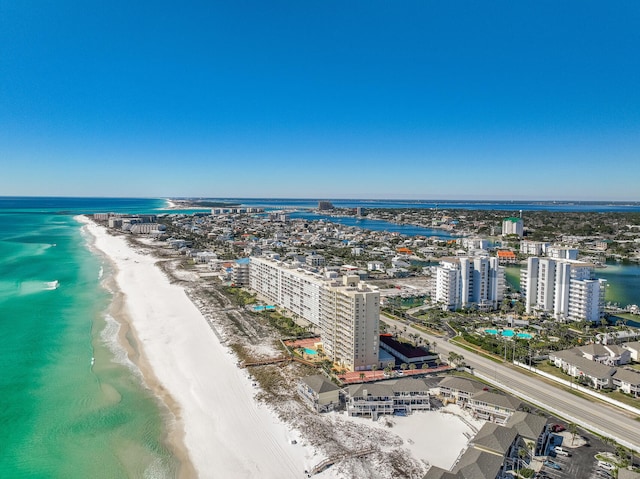 aerial view featuring a water view, a view of the beach, and a city view