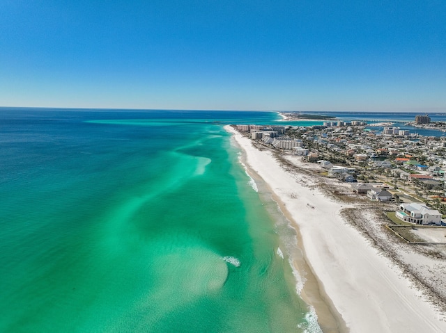 drone / aerial view with a water view and a view of the beach