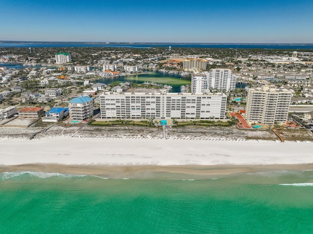 birds eye view of property featuring a view of city, a water view, and a view of the beach