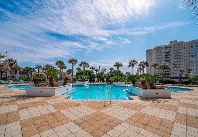 pool featuring a patio area and a jacuzzi