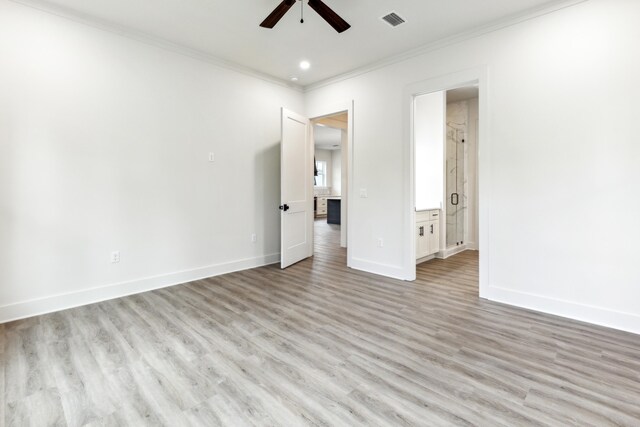 spare room with ceiling fan, light hardwood / wood-style floors, and crown molding