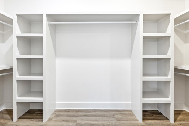 walk in closet featuring hardwood / wood-style floors