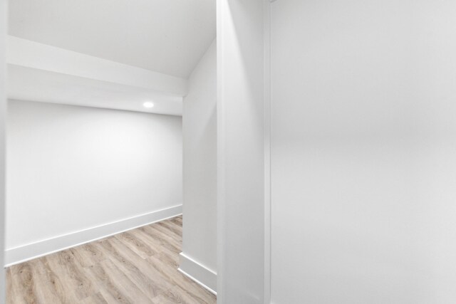 corridor featuring light hardwood / wood-style floors