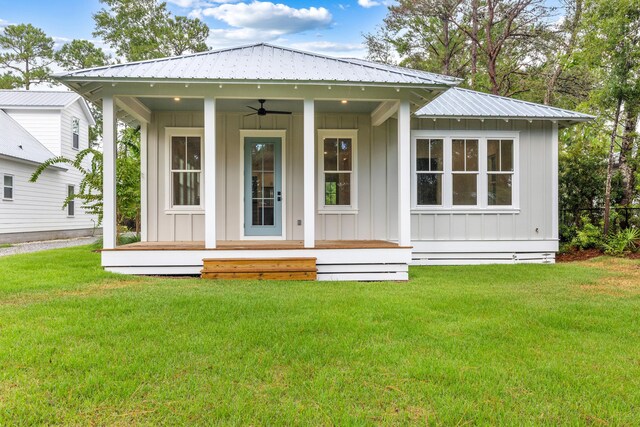 exterior space with a yard and ceiling fan