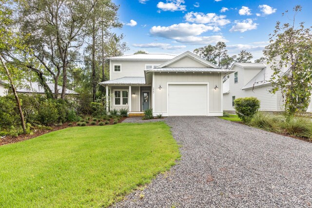 view of front facade with a garage and a front lawn