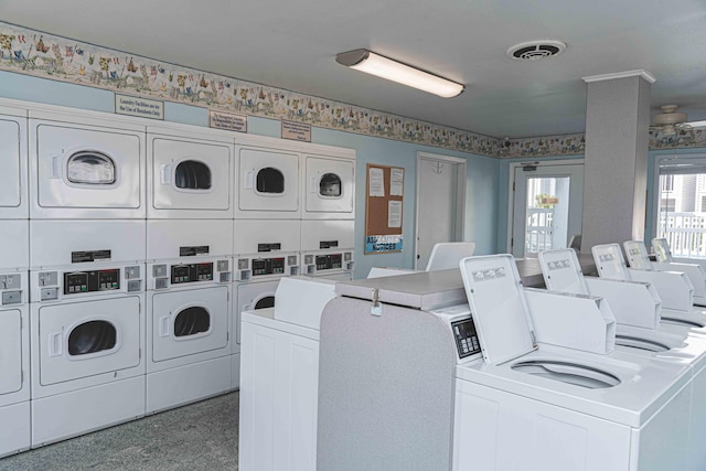 clothes washing area featuring stacked washer and clothes dryer and independent washer and dryer