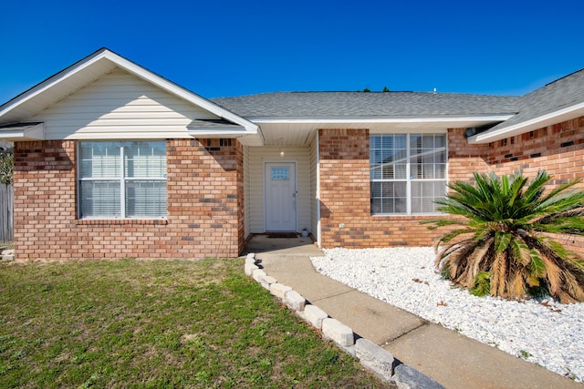 view of front of home with a front lawn