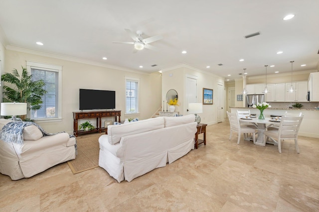 tiled living room with ceiling fan and crown molding