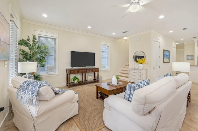 living room featuring ornamental molding and ceiling fan