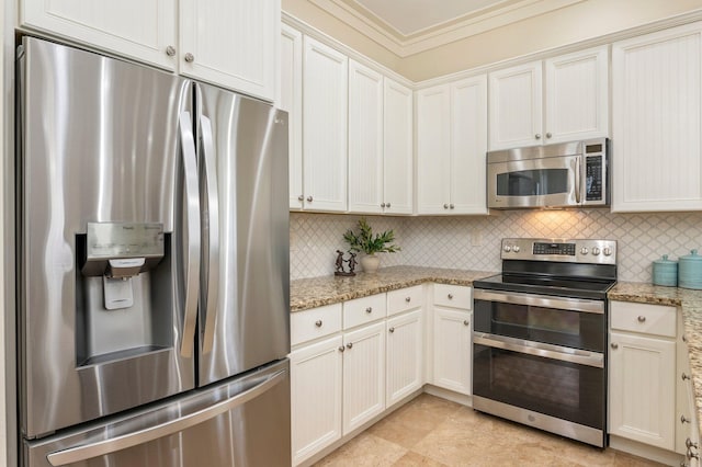 kitchen featuring tasteful backsplash, stainless steel appliances, and light stone countertops