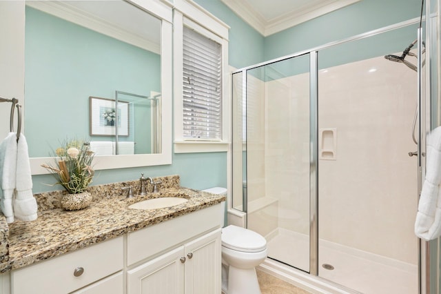 bathroom with walk in shower, toilet, crown molding, and vanity with extensive cabinet space